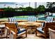 Outdoor fire pit area with seating overlooking the tennis courts at 3229 Carmichael Pl, Duluth, GA 30097