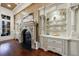 Detailed view of ornate fireplace with built-in shelving and decorative accents at 3229 Carmichael Pl, Duluth, GA 30097
