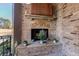 Outdoor fireplace with decorative mantel and brick surround at 3229 Carmichael Pl, Duluth, GA 30097