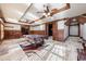 Spacious game room with a pool table, tile flooring, and multiple ceiling fans at 3229 Carmichael Pl, Duluth, GA 30097
