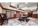 Game room with pool table, wood paneling, and natural light from large windows at 3229 Carmichael Pl, Duluth, GA 30097
