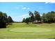 Beautiful golf course with lush green grass and trees at 3229 Carmichael Pl, Duluth, GA 30097