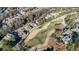 Aerial view showcasing a lush green golf course and surrounding homes at 3229 Carmichael Pl, Duluth, GA 30097