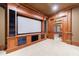 Home theater with projector, screen, and a doorway to an adjacent room at 3229 Carmichael Pl, Duluth, GA 30097