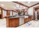 Basement kitchen with granite countertops, farmhouse sink, and stainless steel appliances at 3229 Carmichael Pl, Duluth, GA 30097