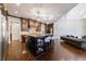 Spacious kitchen with dark wood cabinets, large island, and stainless steel appliances at 3229 Carmichael Pl, Duluth, GA 30097