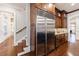 Kitchen with stainless steel refrigerator, wood cabinets, and granite countertops at 3229 Carmichael Pl, Duluth, GA 30097
