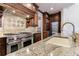 Kitchen features custom cabinets, stainless steel appliances, and granite countertops at 3229 Carmichael Pl, Duluth, GA 30097