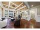 Spacious living room with coffered ceiling, fireplace, and built-in shelving at 3229 Carmichael Pl, Duluth, GA 30097