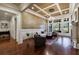 Spacious living room with coffered ceiling, fireplace, and large windows at 3229 Carmichael Pl, Duluth, GA 30097
