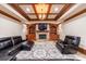 Basement living room with fireplace, built-in shelving, and leather furniture at 3229 Carmichael Pl, Duluth, GA 30097