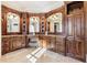 Luxurious Primary bathroom featuring double vanities, custom cabinetry, and elegant fixtures at 3229 Carmichael Pl, Duluth, GA 30097