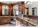 Luxurious Primary bathroom with -and- vanities, custom cabinetry, and granite countertops at 3229 Carmichael Pl, Duluth, GA 30097