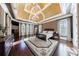 Spacious main bedroom with tray ceiling, chandelier, and large windows at 3229 Carmichael Pl, Duluth, GA 30097
