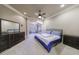 Main bedroom with a ceiling fan, carpeted floors, a tufted bed, and dark wood furniture at 3229 Carmichael Pl, Duluth, GA 30097