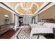 Large main bedroom featuring a tray ceiling, chandelier, and plush carpeting at 3229 Carmichael Pl, Duluth, GA 30097