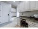 Mudroom with built-in cabinets, bench, and a workspace at 3229 Carmichael Pl, Duluth, GA 30097