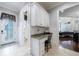Mudroom featuring built-in desk, storage, and access to the living area at 3229 Carmichael Pl, Duluth, GA 30097
