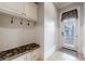 Mudroom with a built-in bench, storage, and access to the exterior at 3229 Carmichael Pl, Duluth, GA 30097