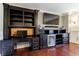 Home office with custom black desk and entertainment area and lots of light at 3229 Carmichael Pl, Duluth, GA 30097