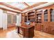 Home office with lots of natural light, hardwood floors, and custom built-ins at 3229 Carmichael Pl, Duluth, GA 30097