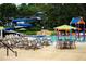 Community pool with waterslide, splash pad, lounge chairs, and umbrellas at 3229 Carmichael Pl, Duluth, GA 30097