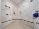 Spacious tiled shower with multiple showerheads and built-in shelves at 3229 Carmichael Pl, Duluth, GA 30097