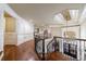 Elegant staircase leading to second story, with view of the foyer and main door at 3229 Carmichael Pl, Duluth, GA 30097