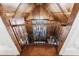 View of upstairs hallway with wood ceiling and iron railing at 3229 Carmichael Pl, Duluth, GA 30097