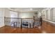 Upstairs hallway with hardwood floors, ornate iron railing, and built-in bookshelf at 3229 Carmichael Pl, Duluth, GA 30097
