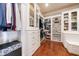 Spacious walk-in closet with built-in shelving, drawers, and ample storage space at 3229 Carmichael Pl, Duluth, GA 30097