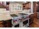 Close-up of the Wolf range with double ovens and stainless steel finish at 3229 Carmichael Pl, Duluth, GA 30097