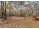 Spacious backyard with mature trees and a deck at 290 Sable Cir, Covington, GA 30016