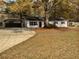 One-story home with a carport, driveway, and front yard at 30 N Cleveland Church Rd, Mcdonough, GA 30253