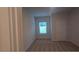 Bright bedroom with carpeted floor and a window at 304 Bianca Way, Mcdonough, GA 30253