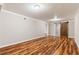 Finished basement with wood-look flooring and barn door at 325 Oak St, Fayetteville, GA 30215