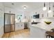 Modern kitchen with white shaker cabinets, quartz countertops, and stainless steel appliances at 2106 Cloverdale, Atlanta, GA 30316