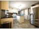 Bright kitchen featuring white cabinets, stainless steel appliances, and tile flooring at 5166 Ridge Tarn, Acworth, GA 30102