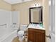 Bathroom with white fixtures, a shower/tub combo, and wood vanity at 680 Horsley Mill Rd, Carrollton, GA 30116