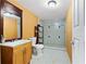 Full bathroom with a tiled shower, single vanity, and toilet at 680 Horsley Mill Rd, Carrollton, GA 30116