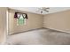 Spacious bedroom with neutral walls, carpeted floors, and ceiling fan at 680 Horsley Mill Rd, Carrollton, GA 30116