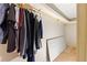 Spacious walk-in closet with hanging clothes and storage space at 680 Horsley Mill Rd, Carrollton, GA 30116