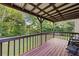 Spacious backyard deck with surrounding trees and grassy area at 680 Horsley Mill Rd, Carrollton, GA 30116