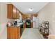 Kitchen equipped with wooden cabinets, black appliances, and ample counter space at 680 Horsley Mill Rd, Carrollton, GA 30116
