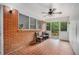 Relaxing sunroom with brick walls, tile floors, and access to the backyard deck at 2307 Hunting Valley Dr, Decatur, GA 30033