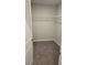 Walk-in closet with wire shelving and plush carpeting at 40 Barton Ln, Covington, GA 30016