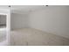 Partially finished basement area with white walls and marbled tile flooring at 5995 Riverside Dr, Atlanta, GA 30328