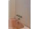 Pink bathtub with silver fixtures and white tile wall at 8450 Union Grove Rd, Lithonia, GA 30058