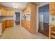 Bright kitchen with ample wood cabinets, granite countertops, and tile backsplash at 8450 Union Grove Rd, Lithonia, GA 30058