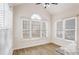 Breakfast nook with large windows, wood-look flooring, and view to backyard at 1547 Welch Ct, Suwanee, GA 30024